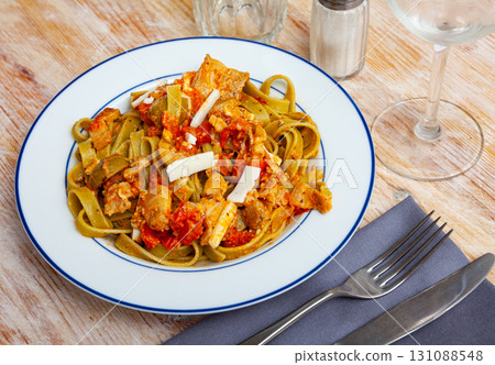 Italian spinach tagliatelle pasta with tomato sauce Italian spinach tagliatelle pasta with tomato sauce 131088548