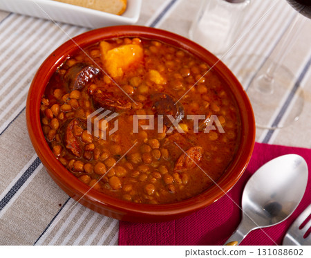 Lentejas con chorizo, beans stewed with chorizo Lentejas con chorizo, beans stewed with chorizo 131088602