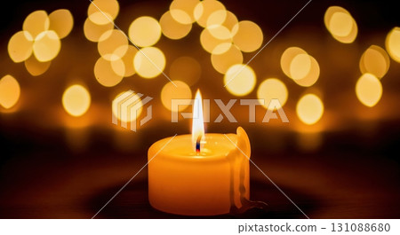 Candle flame and warm bokeh background 131088680