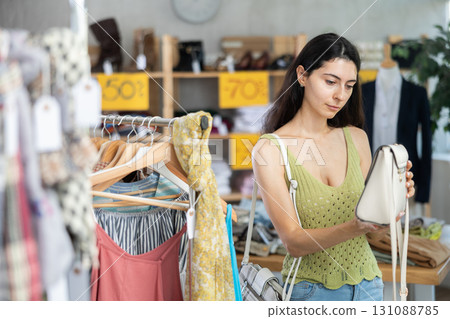 Armenian woman choosing a fashionable handbag 131088785