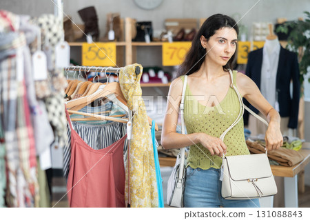 Armenian woman choosing a fashionable handbag 131088843