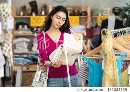 Armenian woman choosing a fashionable handbag Armenian woman choosing a fashionable handbag 131088869