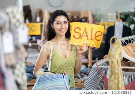 Armenian woman holds a poster with an inscription about the distribution 131088885