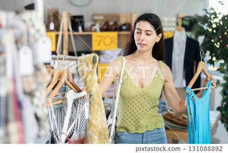 Armenian woman chooses a summer dress on sale 131088892