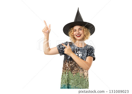 Young woman in a witch hat, excited for Halloween, isolated on white, PNG 131089023
