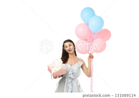 Woman smiles while holding balloons and a present, isolated on white, PNG Woman smiles while holding balloons and a present, isolated on white, PNG 131089114