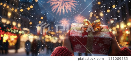 Child's Hand Holding a Beautiful Gift Box 131089383