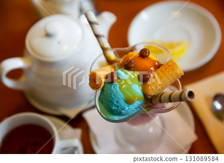 Sweet ice cream dessert in glass bowl 131089584
