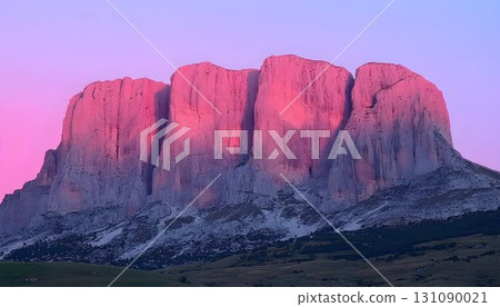 Majestic mountain peaks bathed in the soft glow of a pink sunset Majestic mountain peaks bathed in the soft glow of a pink sunset 131090021