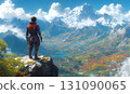 Adventurer Contemplates Majestic Mountain Range, Breathtaking La 131090065