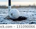 Frosty Golf Ball Nearing the Hole on a Cold Day 131090066