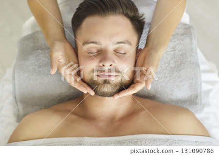 Above view of young man getting facial spa treatment, close-up 131090786
