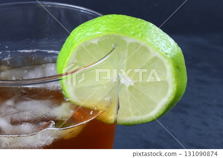 Glass of iced tea with lime Glass of iced tea with lime 131090874
