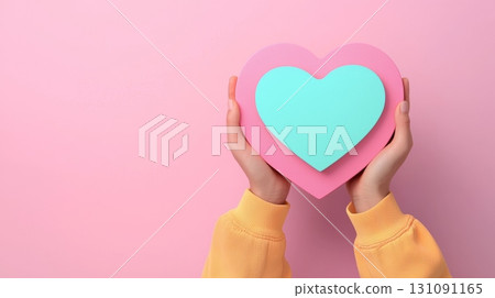 3D Icon of a Hand Holding a Heart in Pastel Colors on a Soft Pink Background 131091165
