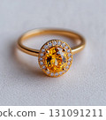 Elegant Yellow Diamond Ring with Halo Setting on Soft Background 131091211