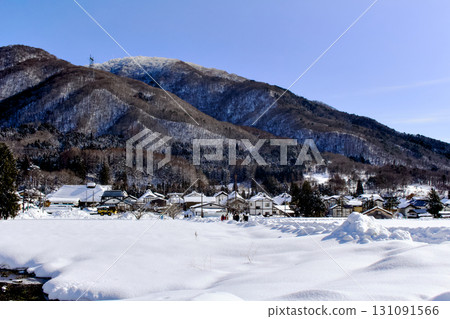 Beautiful snowy countryside and blue sky 131091566