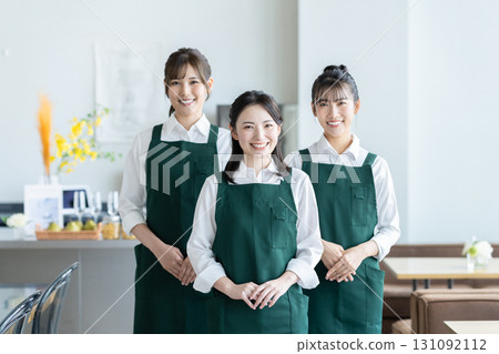 Young female staff working at a cafe 131092112