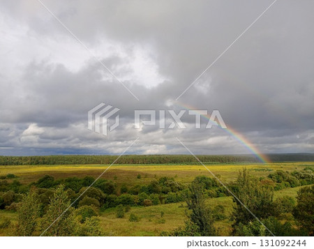 Summer landscape with rainbow over river, fields, forest, beauty Summer landscape with rainbow over river, fields, forest, beauty 131092244