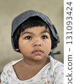 Portrait of a cute Asian baby girl wearing a cap. Portrait of a cute Asian baby girl wearing a cap. 131093424