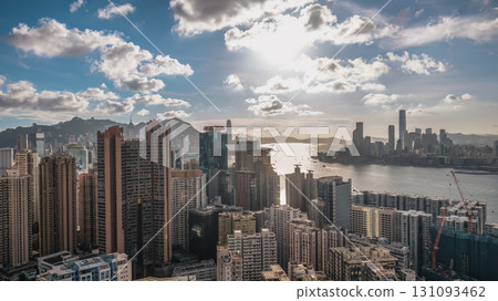 Aug 1 2025 Panoramic View of a Modern City Skyline Under a Bright Blue Sky 131093462