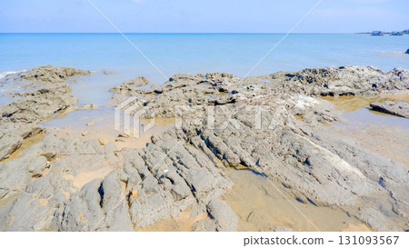 Rugged Shoreline and Calm Blue Ocean on a Sunny Day 131093567