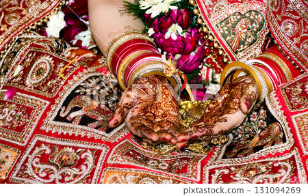 Indian Bride Hands with Mehndi and Bridal Bangles Indian Bride Hands with Mehndi and Bridal Bangles 131094269