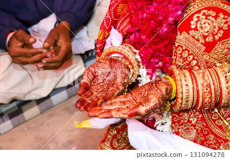 Indian Bride Hands with Mehndi and Bridal Bangles Indian Bride Hands with Mehndi and Bridal Bangles 131094278