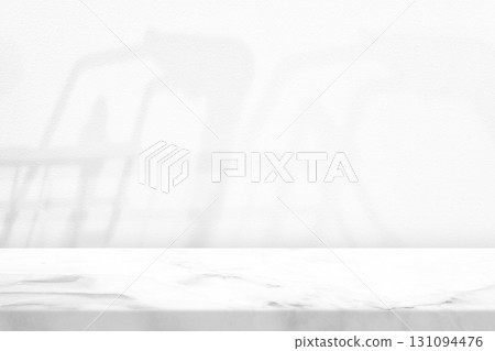 White Marble Table with Shopping Cart Shadow on White Wall Background. White Marble Table with Shopping Cart Shadow on White Wall Background. 131094476