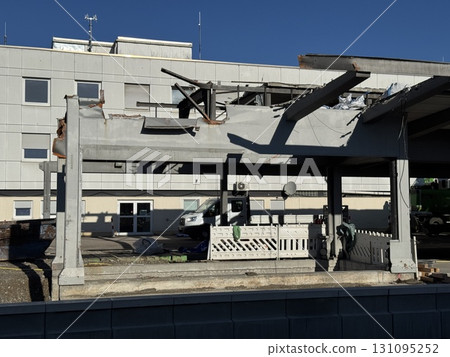 Damaged Structure Featuring Exposed Beams Amidst Surrounding Debris 131095252