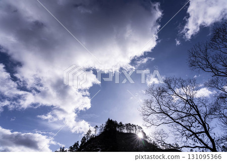 Winter sky and morning sun 131095366