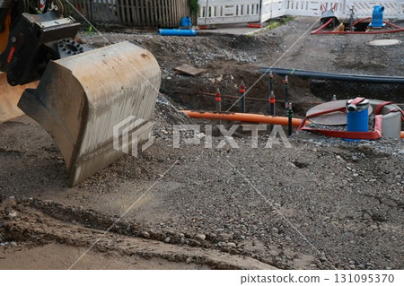Large construction site with a large shovel digging into the ground Large construction site with a large shovel digging into the ground 131095370
