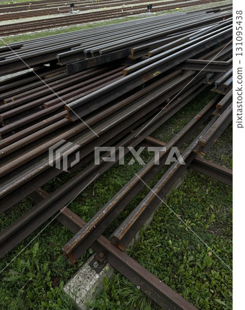 Metal pipes are stacked neatly in a busy construction yard area Metal pipes are stacked neatly in a busy construction yard area 131095438