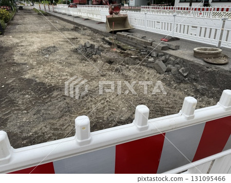 Construction Site Featuring a Barricade as Well as Ongoing Excavation Activities Construction Site Featuring a Barricade as Well as Ongoing Excavation Activities 131095466