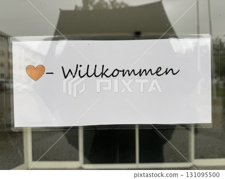 Here is a warm and heartfelt welcome sign, beautifully crafted in the German language, inviting all Here is a warm and heartfelt welcome sign, beautifully crafted in the German language, inviting all 131095500