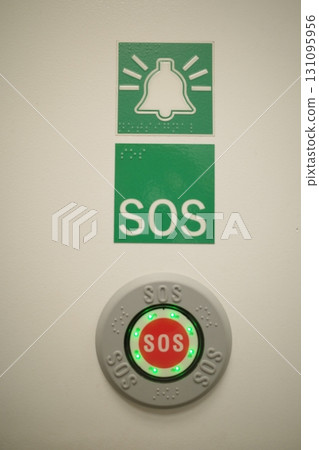 Green sign with a bell and the word SOS on it Green sign with a bell and the word SOS on it 131095956