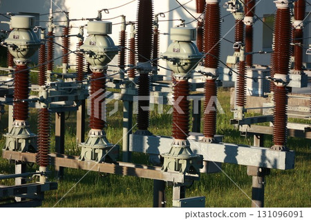 A bunch of power lines are in a field 131096091