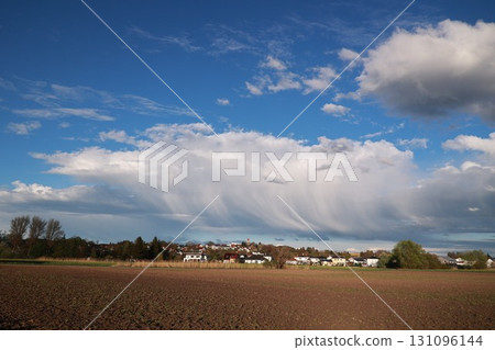 Large cloud in the sky with a blue sky behind it 131096144