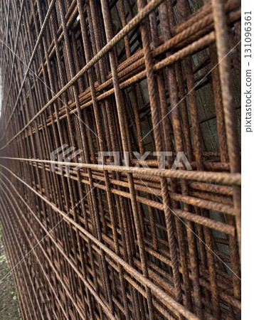 Close up of a metal fence with a lot of rust on it 131096361