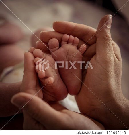 Sleeping baby boy sleeping on mother hands closeup top view. Motherhood, breastfeeding Sleeping baby boy sleeping on mother hands closeup top view. Motherhood, breastfeeding 131096443