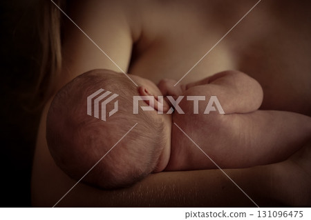 Sleeping baby boy sleeping on mother hands closeup top view. Motherhood, breastfeeding 131096475