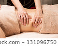 Young Asian woman getting a belly oil massage. 131096750