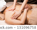 A young Asian woman is getting a back oil massage. 131096758