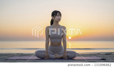 Woman doing yoga exercises on the beach at sunrise 131096862
