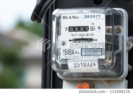 Electric measuring power meter for energy cost at home and office. 131098238