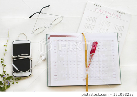 notebook, mobile phone and calendar for planner business work  131098252