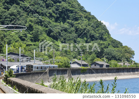 A Nippo Line train running along Kinko Bay A Nippo Line train running along Kinko Bay 131098550