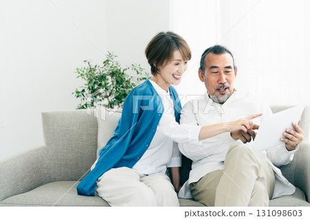 Senior couple looking at laptop Senior couple looking at laptop 131098603