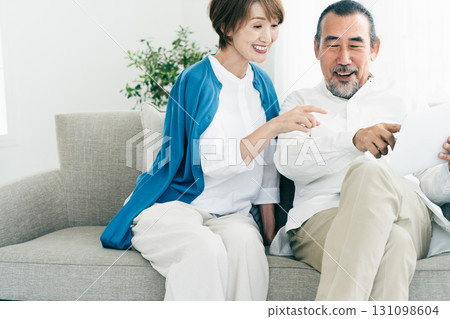 Senior couple looking at laptop Senior couple looking at laptop 131098604