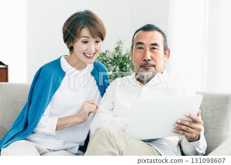 Senior couple looking at laptop Senior couple looking at laptop 131098607