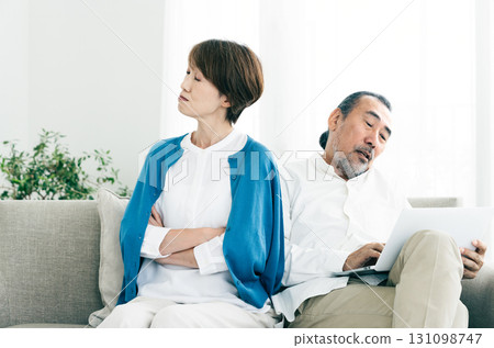 Senior couple arguing on the sofa 131098747